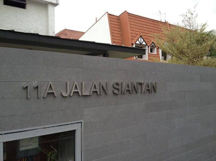 Metal landed house sign