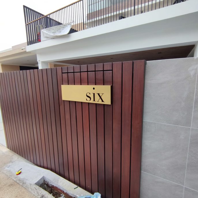 Gold metal landed house sign